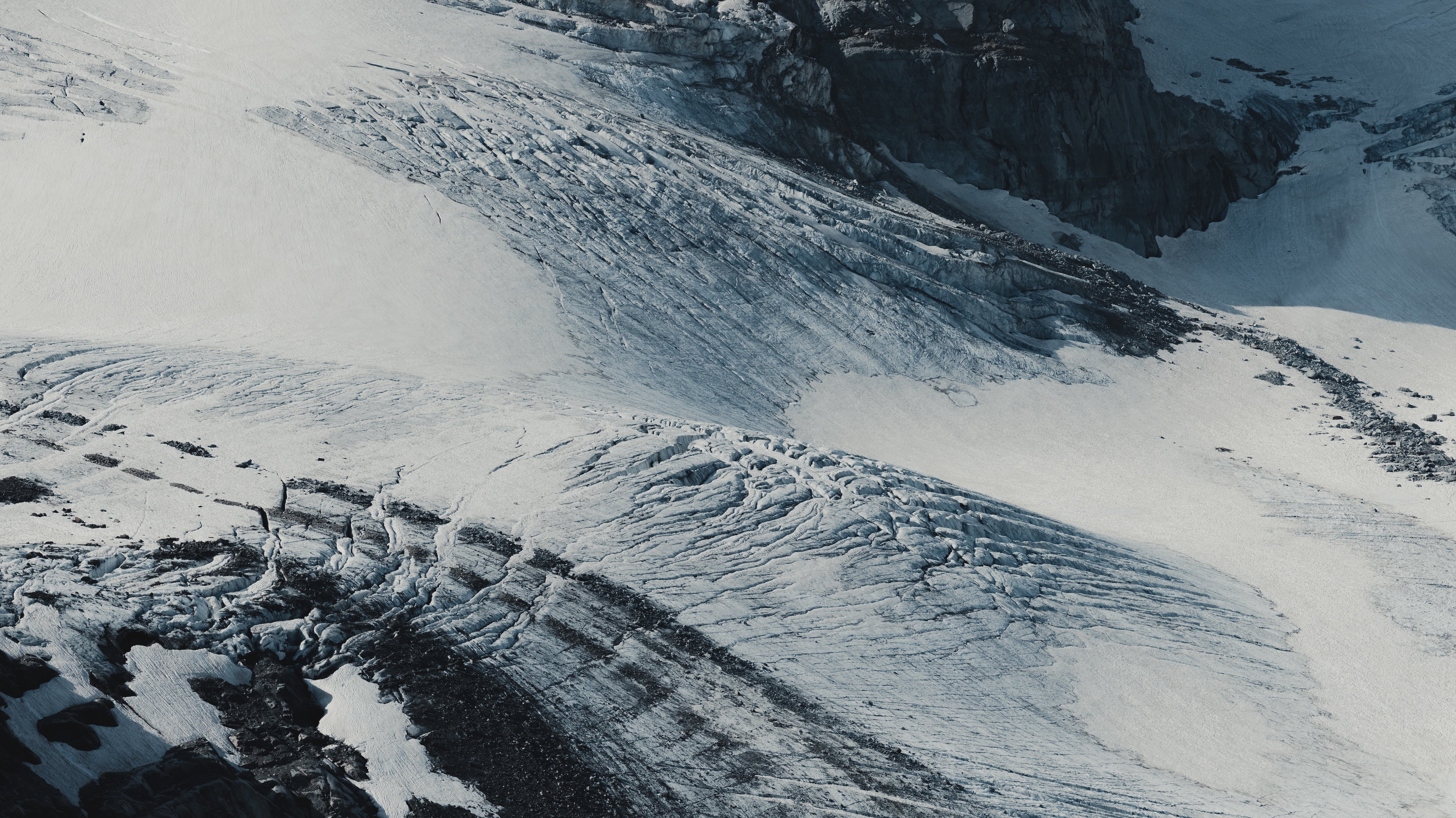 Snowy mountain landscape with a structure.