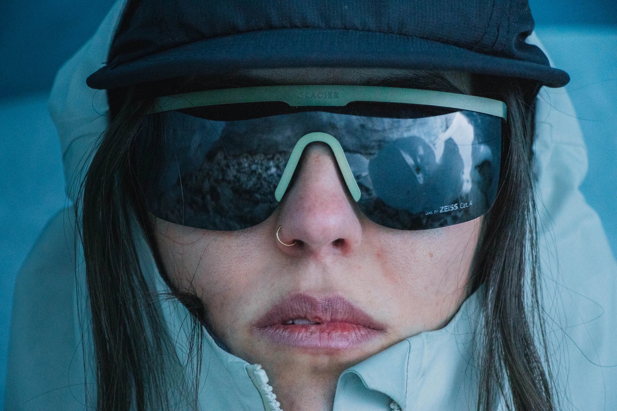 Person wearing cat 3. Zeiss lenses olive colored Pierredar sunglasses in the Swiss glacier background.