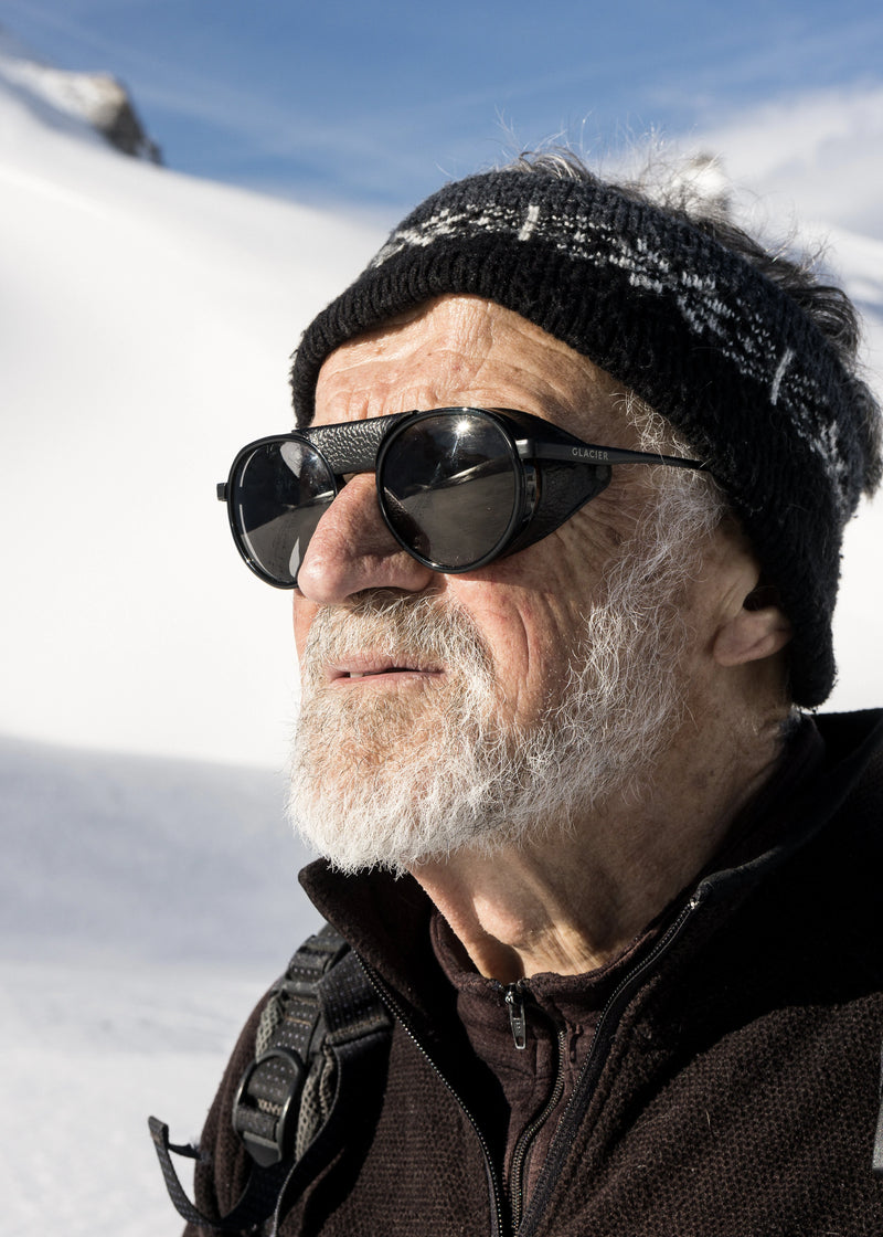 Roland wearing black moiry sunglasses in the Alps