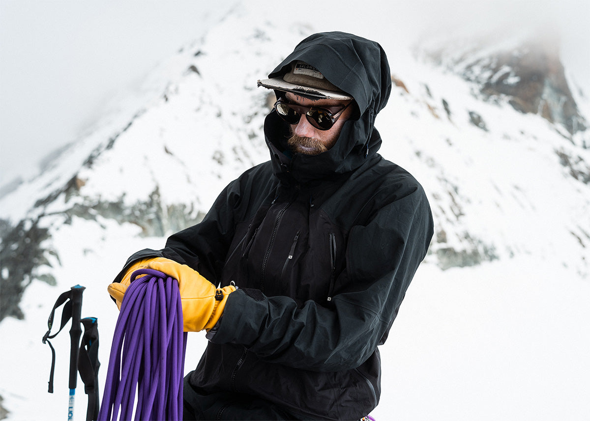 Guy with white sunglasses with wind shields looking at the sun