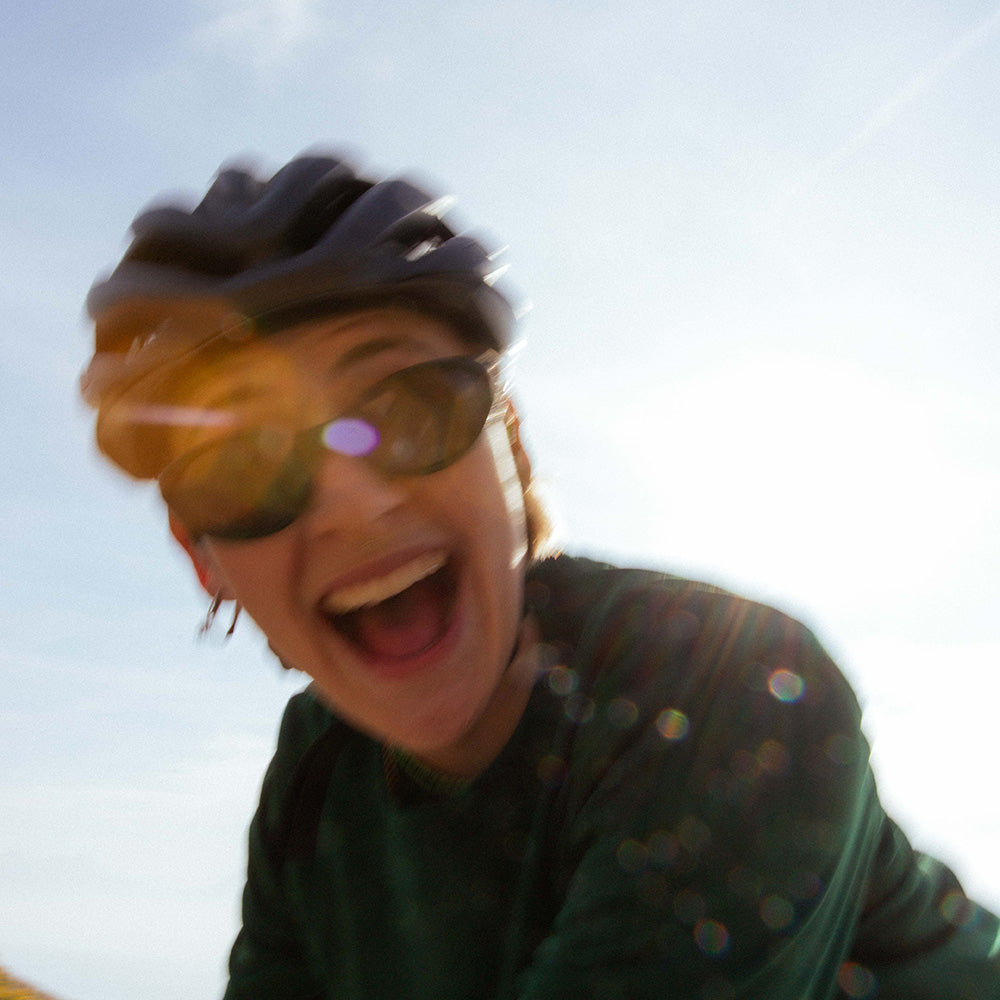 Two people wearing Glacier Sunglasses in the mountains
